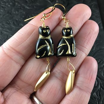 Black and Gold Glass Kitty Cat and Gold Dagger Earrings #kAcL9r2Jv8M