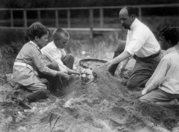 Digital Photo of a Family Burying a Patient Dog in the Sand #H39AC1FoPUs